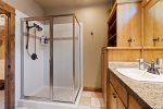 Jack and Jill bathroom shared by upstairs guest rooms with double sinks and shower/tub